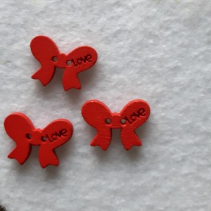 Guzik dziecięcy kokardka czerwony